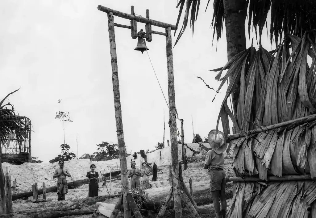 Settlers ringing a church bell at Bahau